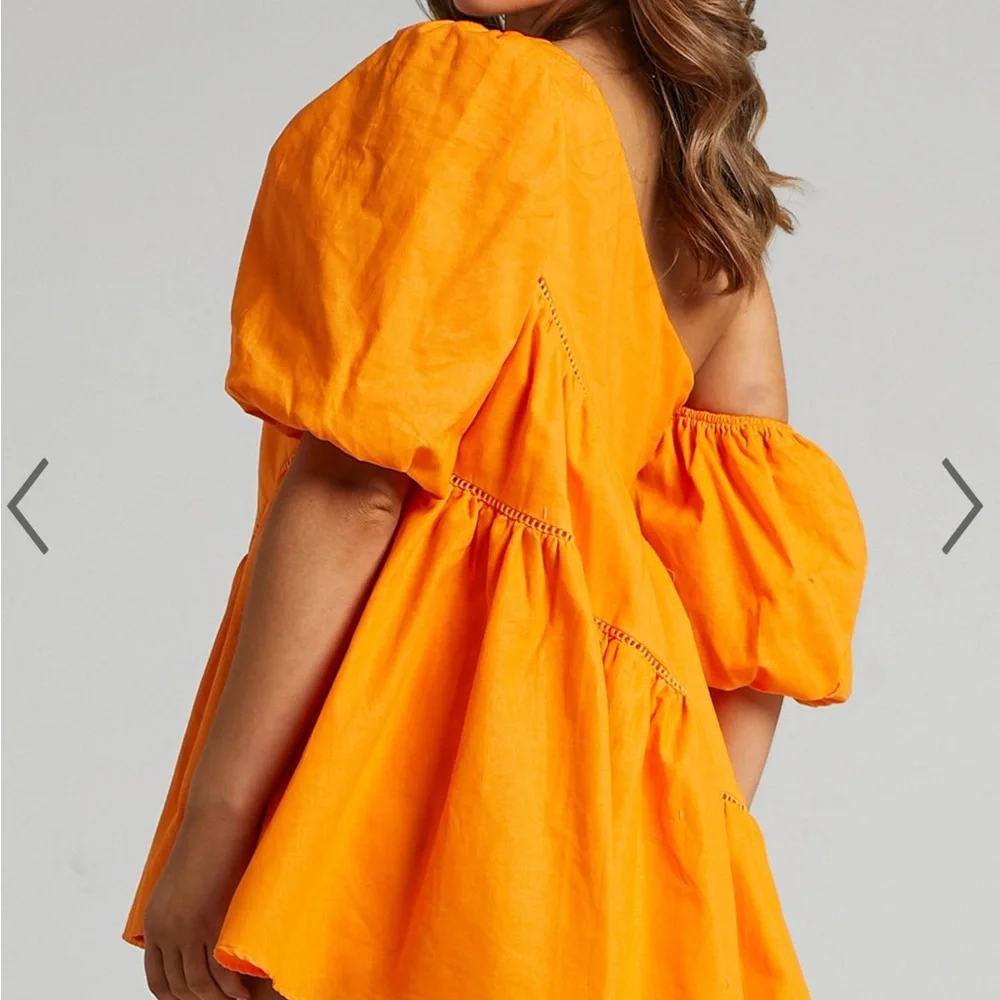 SHOWPO HARLEEN MINI DRESS - ASYMMETRICAL TRIM PUFF SLEEVE DRESS IN ORANGE - Picture 2 of 3
